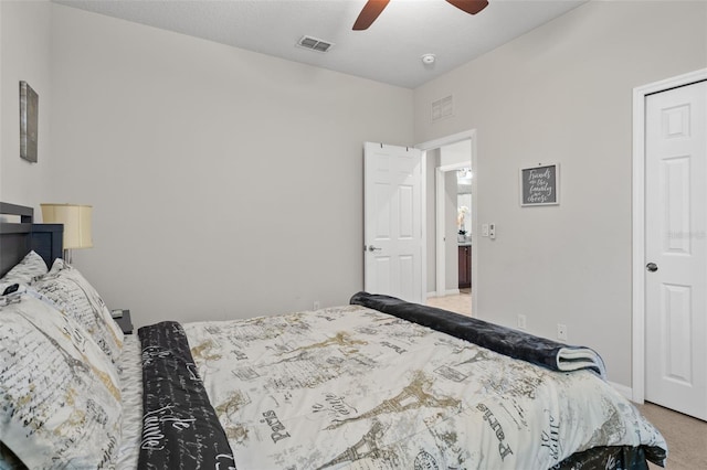 bedroom with ceiling fan and light colored carpet