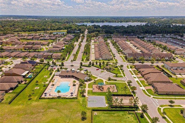 birds eye view of property with a water view