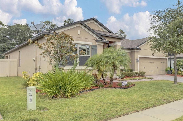 view of front of house featuring a front yard and a garage