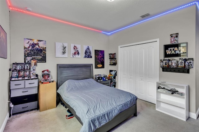 bedroom with carpet and a closet