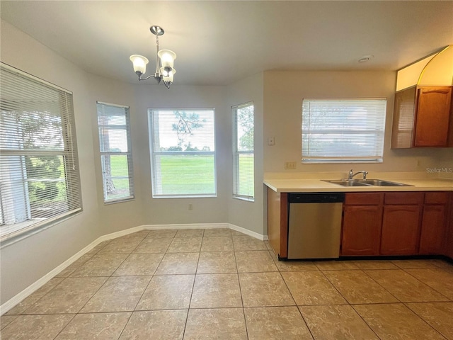 kitchen featuring pendant lighting, dishwasher, an inviting chandelier, sink, and light tile patterned flooring