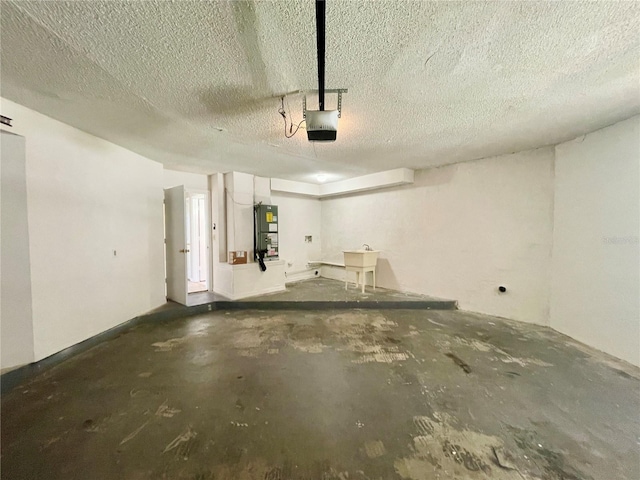 garage with sink and a garage door opener