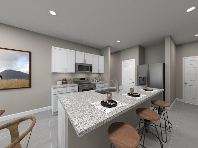 kitchen with a center island with sink, sink, white cabinets, and stainless steel appliances