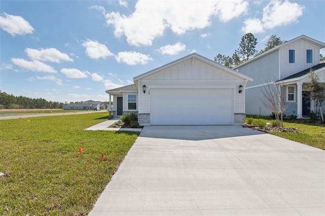 view of front of house featuring driveway, an attached garage, board and batten siding, and a front yard