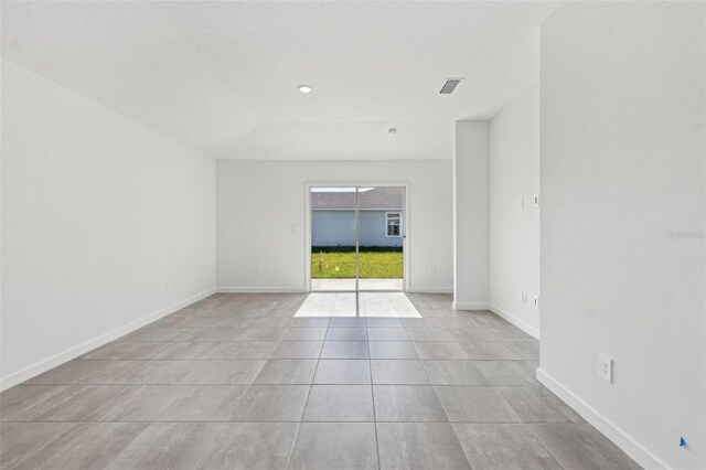 unfurnished room featuring recessed lighting, visible vents, baseboards, and tile patterned floors