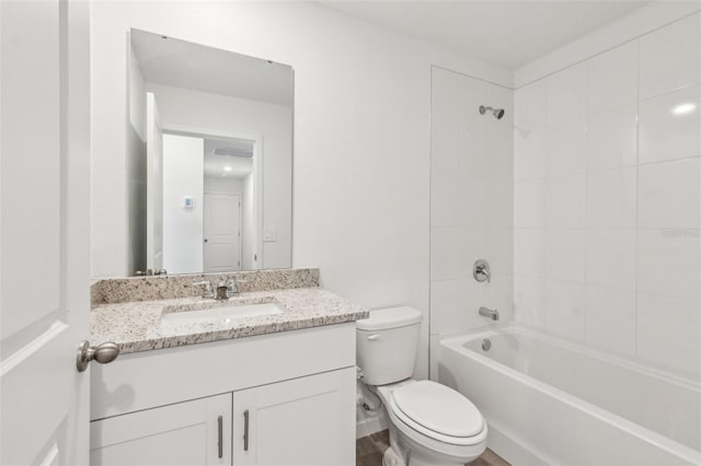 full bath with tub / shower combination, vanity, and toilet