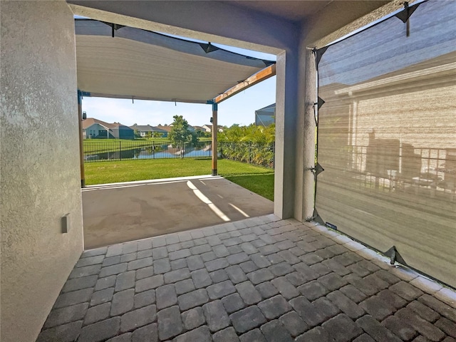 view of patio / terrace with a water view