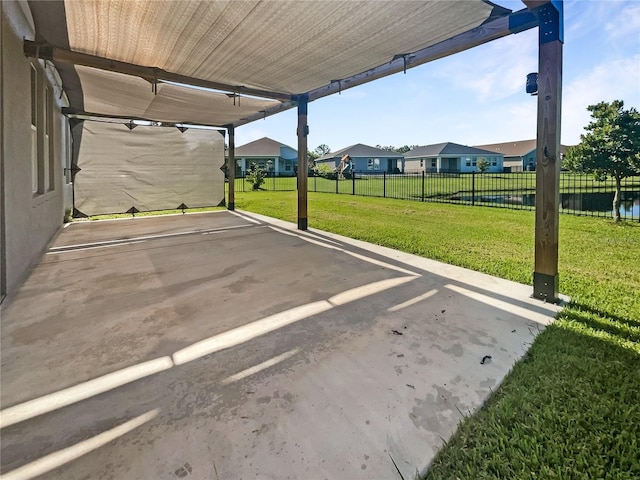 view of vehicle parking featuring a yard