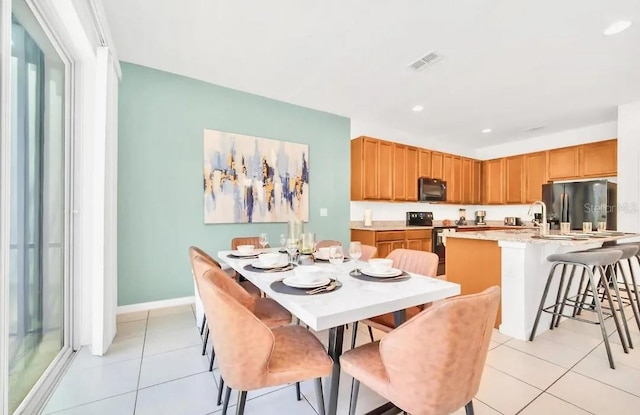 dining area with recessed lighting, light tile patterned floors, baseboards, and visible vents