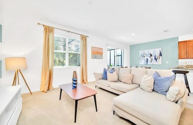 living room featuring light carpet