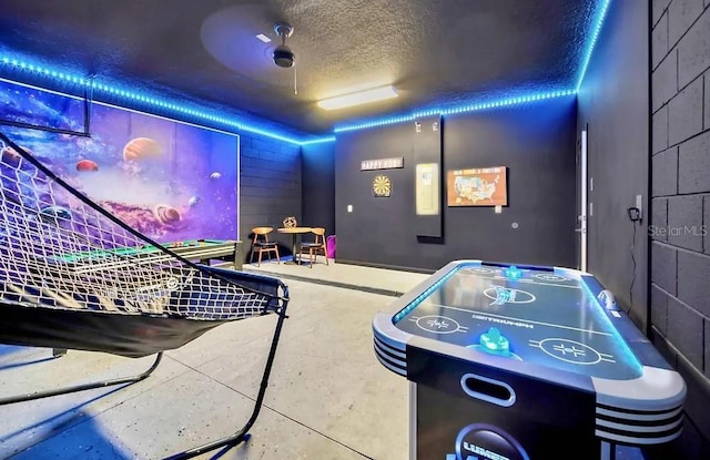 home theater featuring a textured ceiling