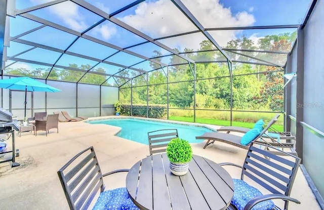 view of pool featuring a patio and a lanai