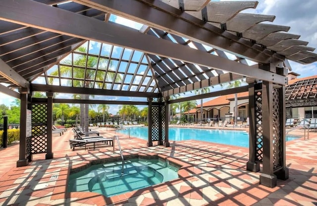 view of pool with a patio, a community hot tub, and a pergola