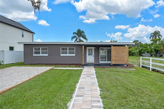 view of front of home with a front yard