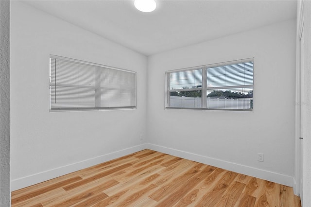 empty room featuring hardwood / wood-style flooring