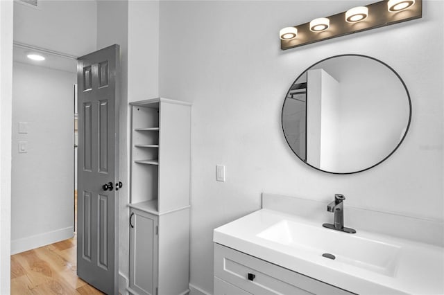 bathroom featuring vanity and hardwood / wood-style floors