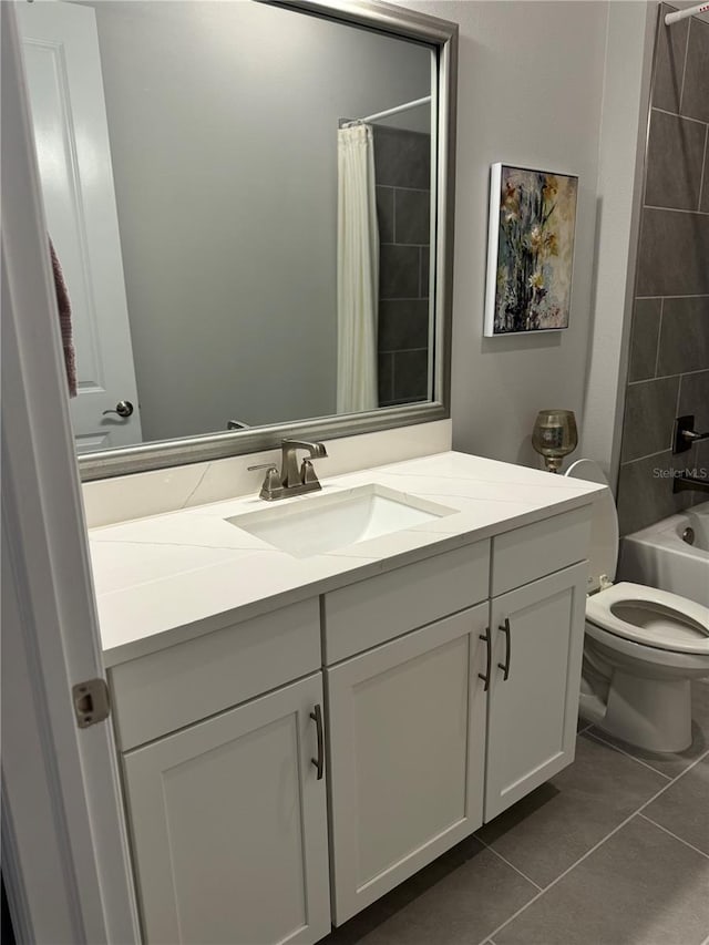 full bathroom featuring tile patterned floors, shower / tub combo with curtain, vanity, and toilet