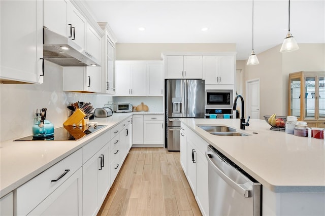 kitchen with black appliances, white cabinets, sink, and hanging light fixtures