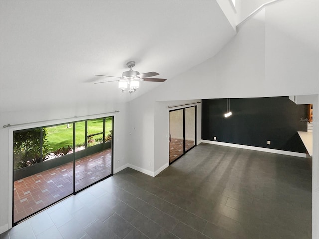 spare room featuring ceiling fan and lofted ceiling