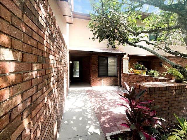 property entrance with a patio