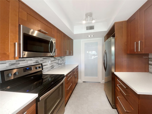 kitchen featuring decorative backsplash and appliances with stainless steel finishes