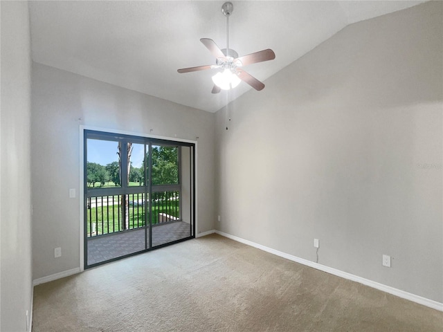 spare room featuring carpet, ceiling fan, and lofted ceiling