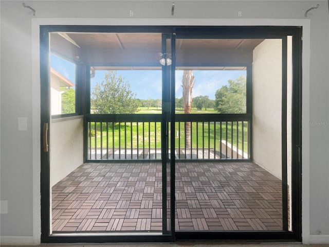 unfurnished sunroom featuring a healthy amount of sunlight