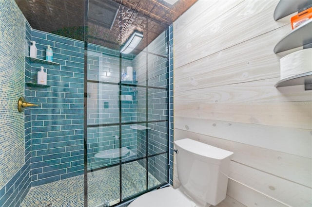 bathroom featuring an enclosed shower and toilet