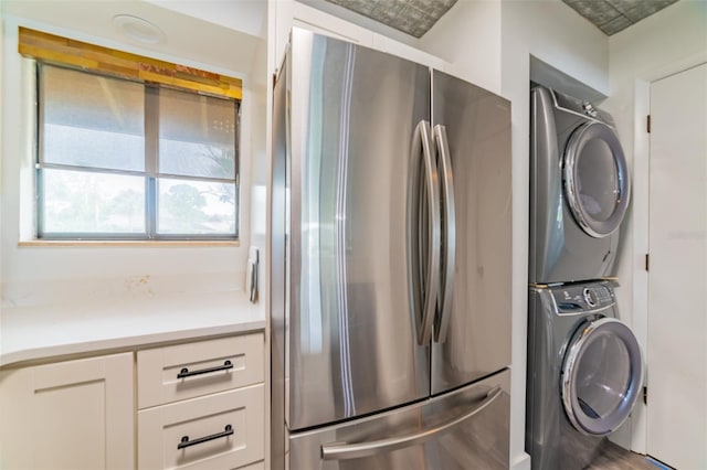 washroom with stacked washer / dryer