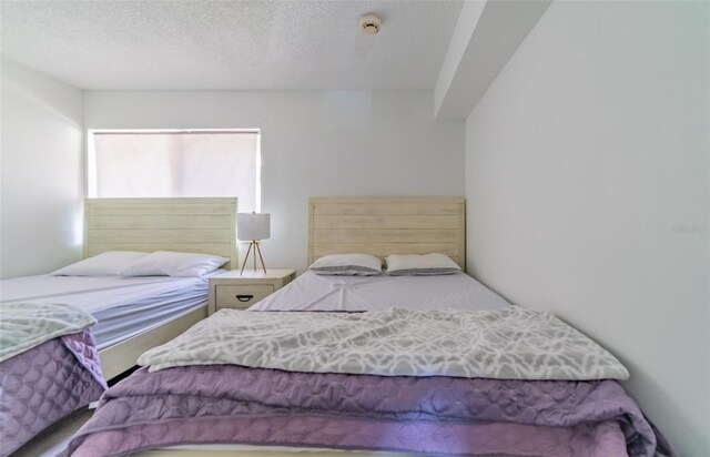 bedroom featuring a textured ceiling