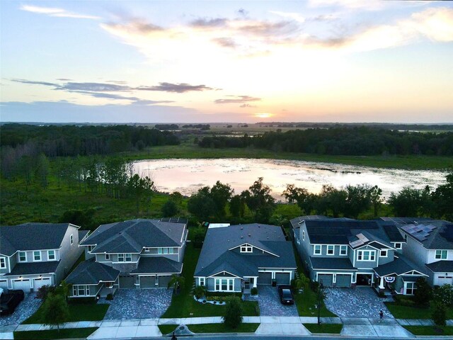 aerial view at dusk with a water view