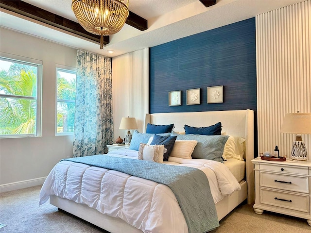 bedroom featuring light colored carpet and beam ceiling