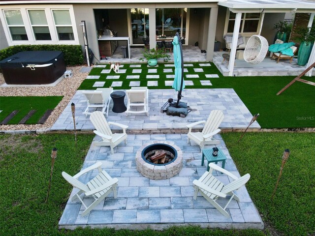 view of yard with a patio area and a fire pit