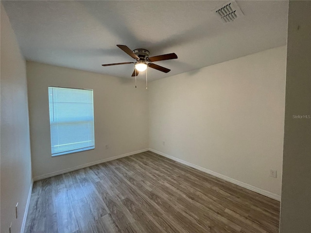 unfurnished room with wood-type flooring and ceiling fan