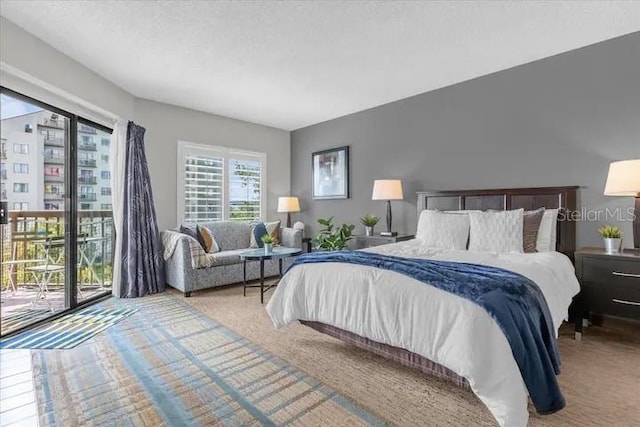 bedroom with light colored carpet and access to exterior