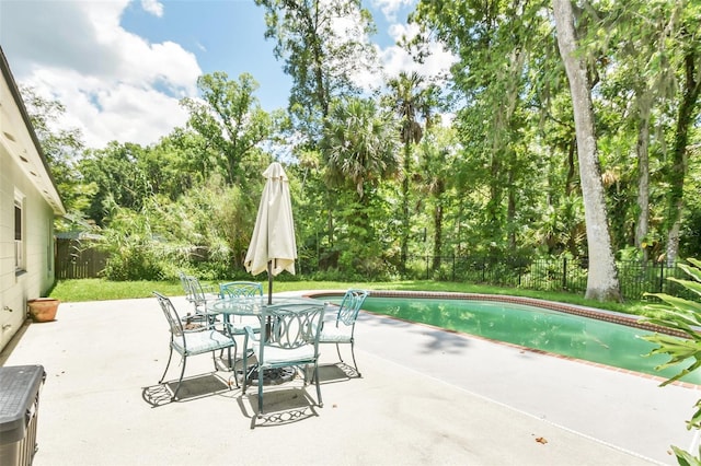 view of patio with a fenced in pool