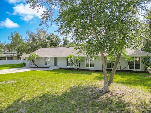 ranch-style home with a front yard