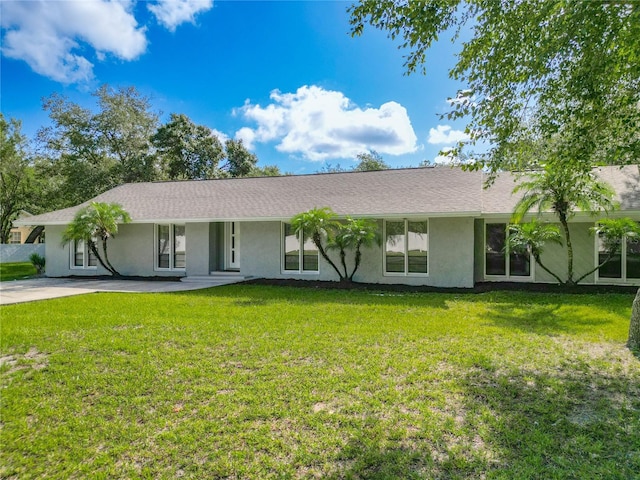 ranch-style home featuring a front yard