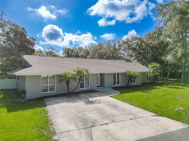 single story home with a front yard