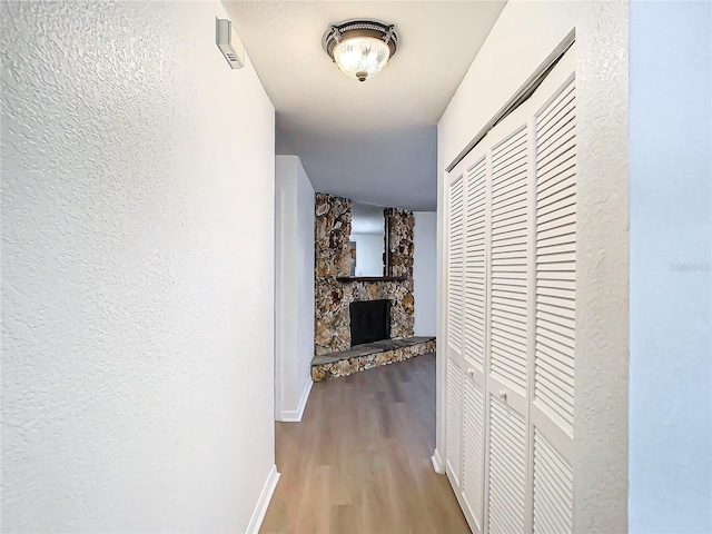 corridor featuring light hardwood / wood-style floors