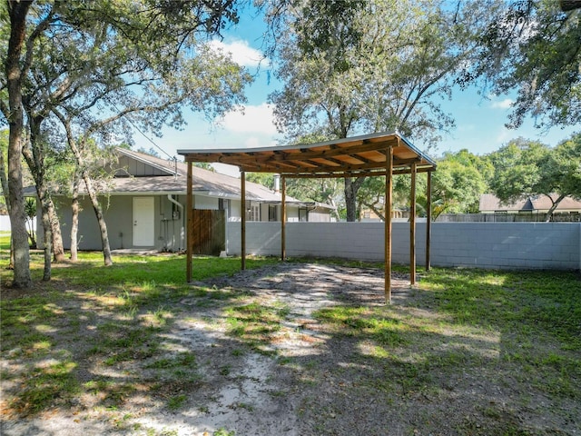 view of yard with a carport