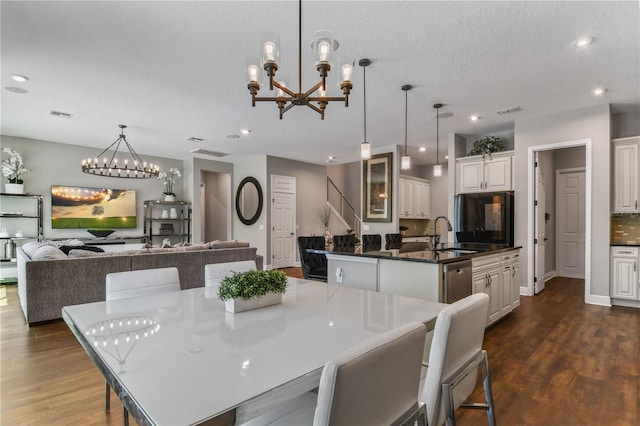 dining space with recessed lighting, visible vents, and dark wood finished floors