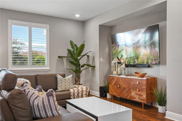 interior space featuring dark wood-style floors and baseboards