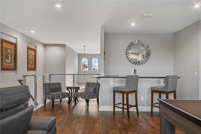 interior space featuring baseboards, visible vents, dark wood-style flooring, and recessed lighting