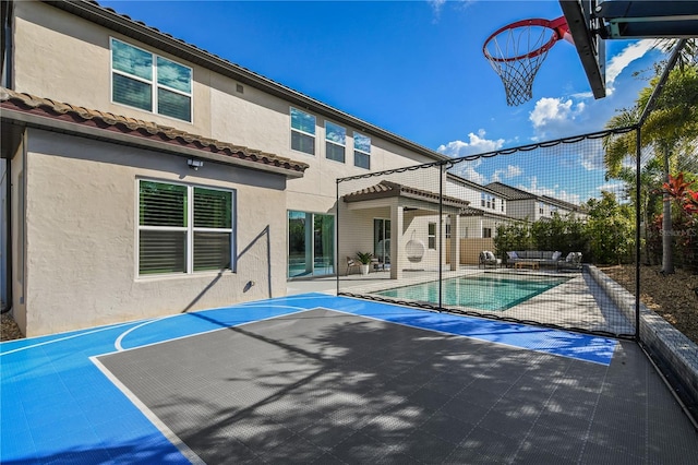 view of basketball court featuring basketball hoop