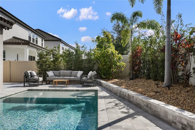 view of swimming pool with a patio area, a fenced backyard, outdoor lounge area, and a fenced in pool