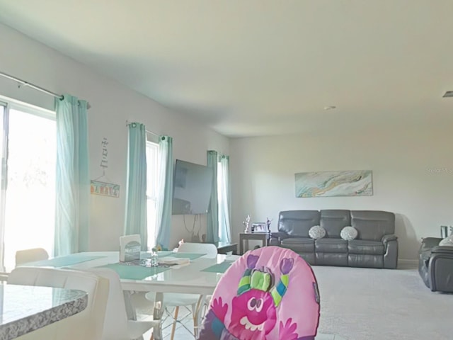 dining area featuring carpet flooring