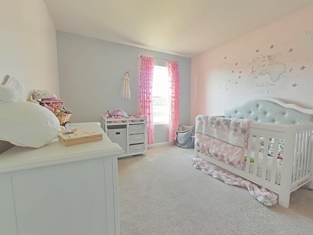 carpeted bedroom with a crib