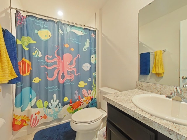 bathroom featuring toilet and vanity