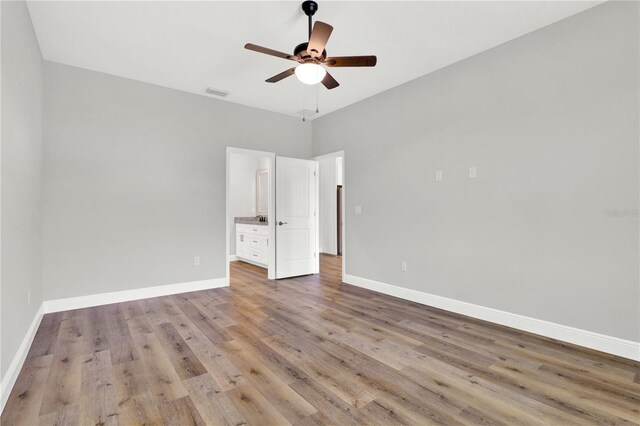 unfurnished bedroom featuring ceiling fan and wood-type flooring